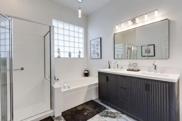 a view of a patio with table and chairs with wooden floor and plants