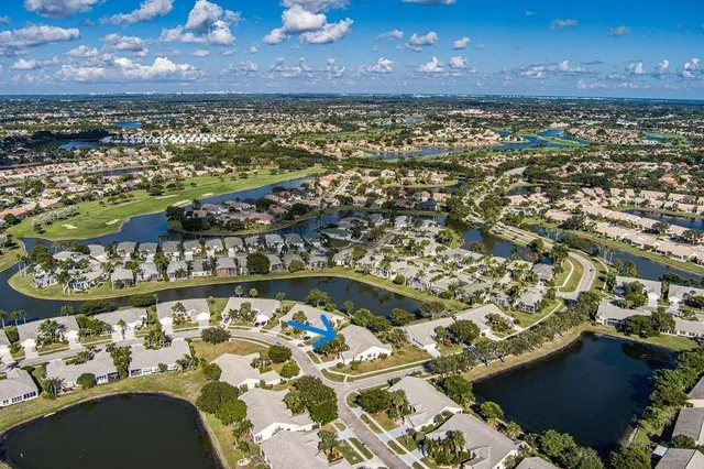 a vase with flowers sitting on a shelf