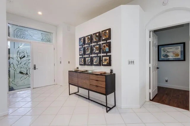 a living room with furniture and kitchen view