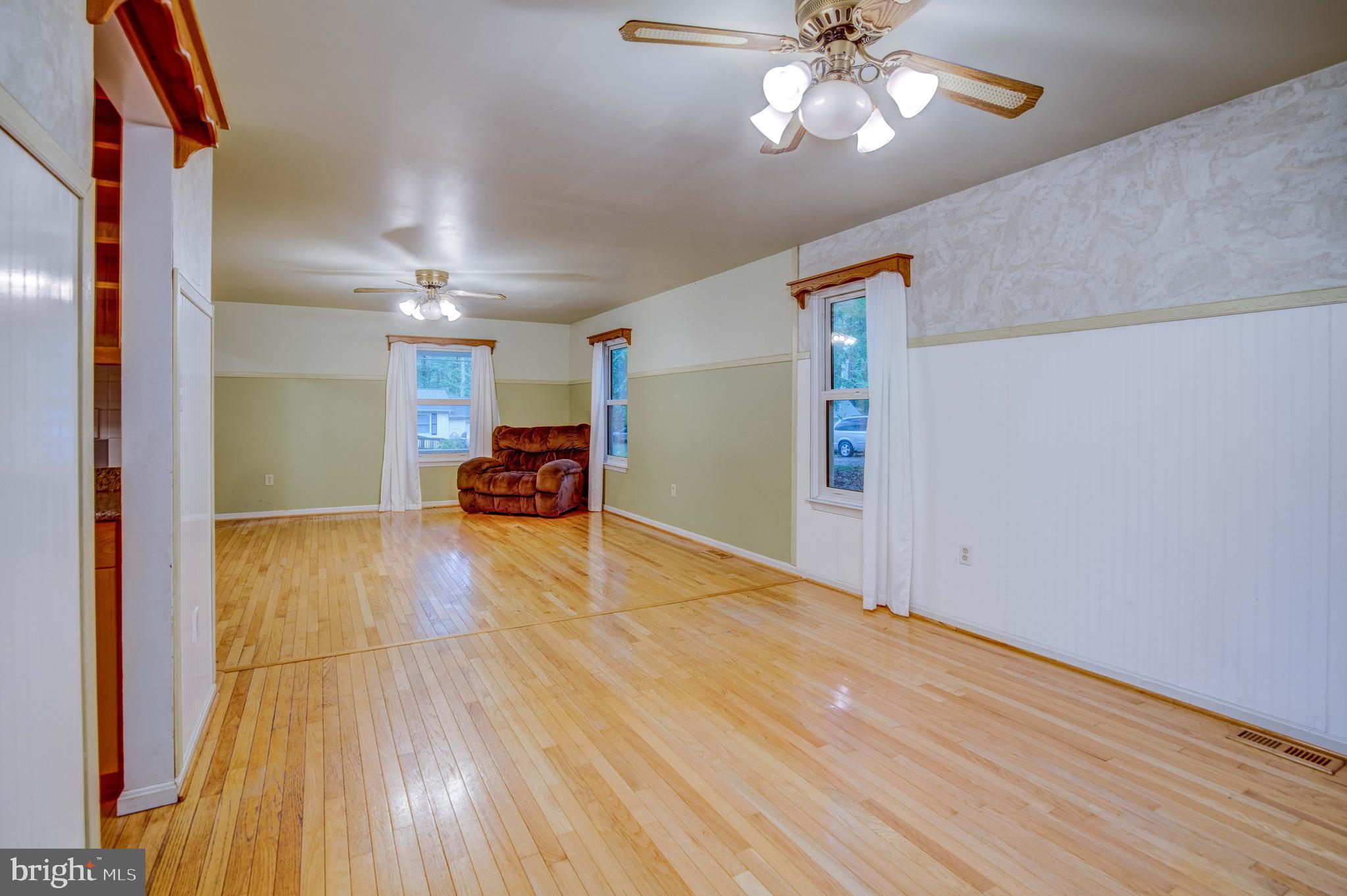 11431 Rawhide Road Lusby, MD 20657 - Photo 15 of 31 a view of empty room with wooden floor