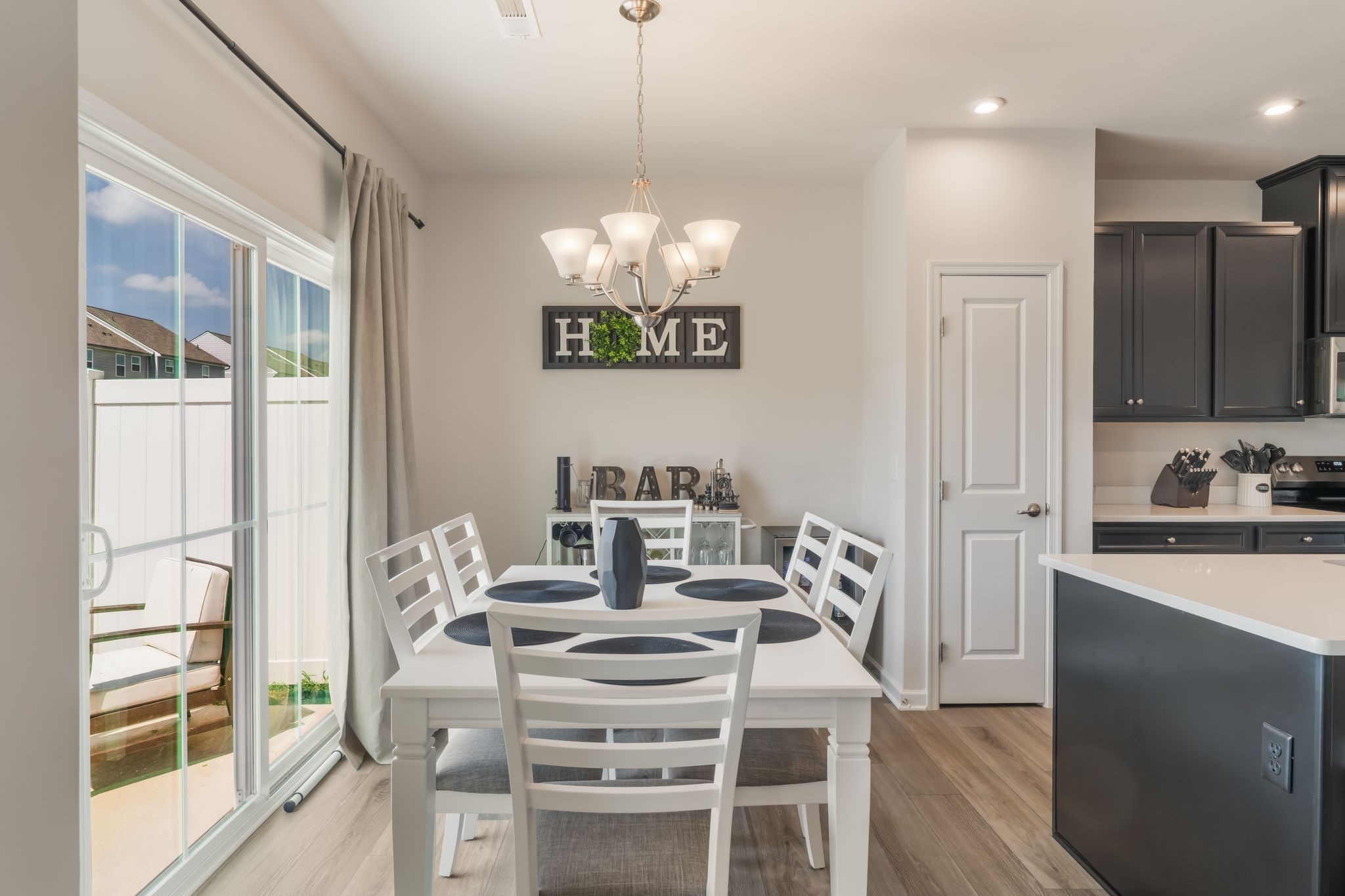 1340 Crescent Ridge Drive Gallatin, TN 37066 - Photo 5 of 10 a view of a dining room with furniture a chandelier and wooden floor