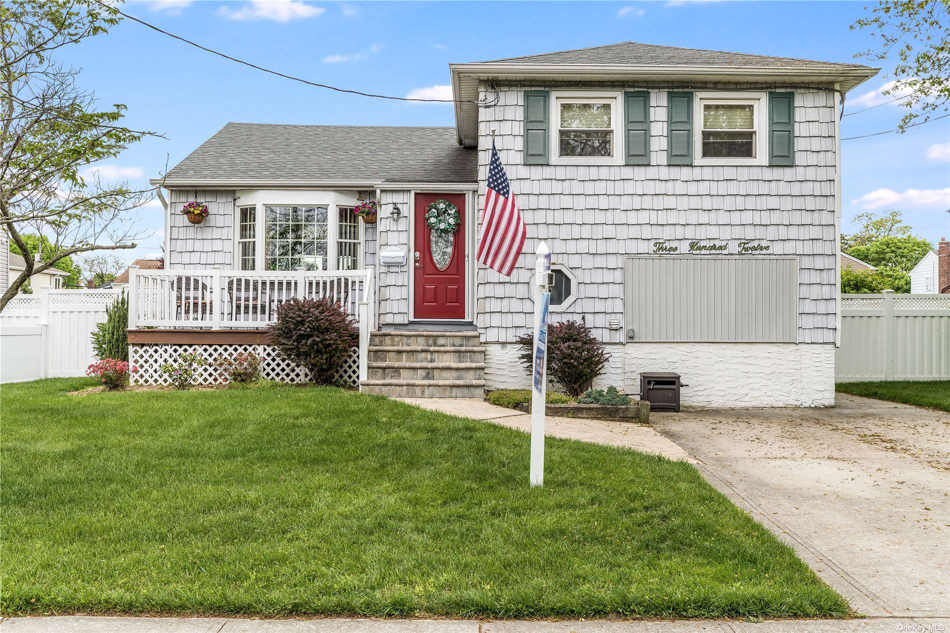 312 Finger Island Road Inwood, NY 11096 - Photo 1 of 1 a front view of a house with a yard
