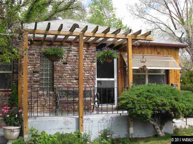601 Imperial Boulevard Reno, NV 89503 - Photo 4 of 13 a view of a house with brick walls and potted plants