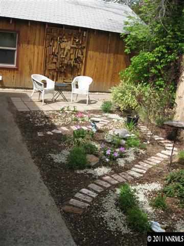 601 Imperial Boulevard Reno, NV 89503 - Photo 5 of 13 a backyard of a house with table and chairs