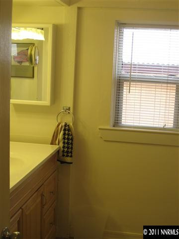 601 Imperial Boulevard Reno, NV 89503 - Photo 9 of 13 a bathroom with a bathtub and window