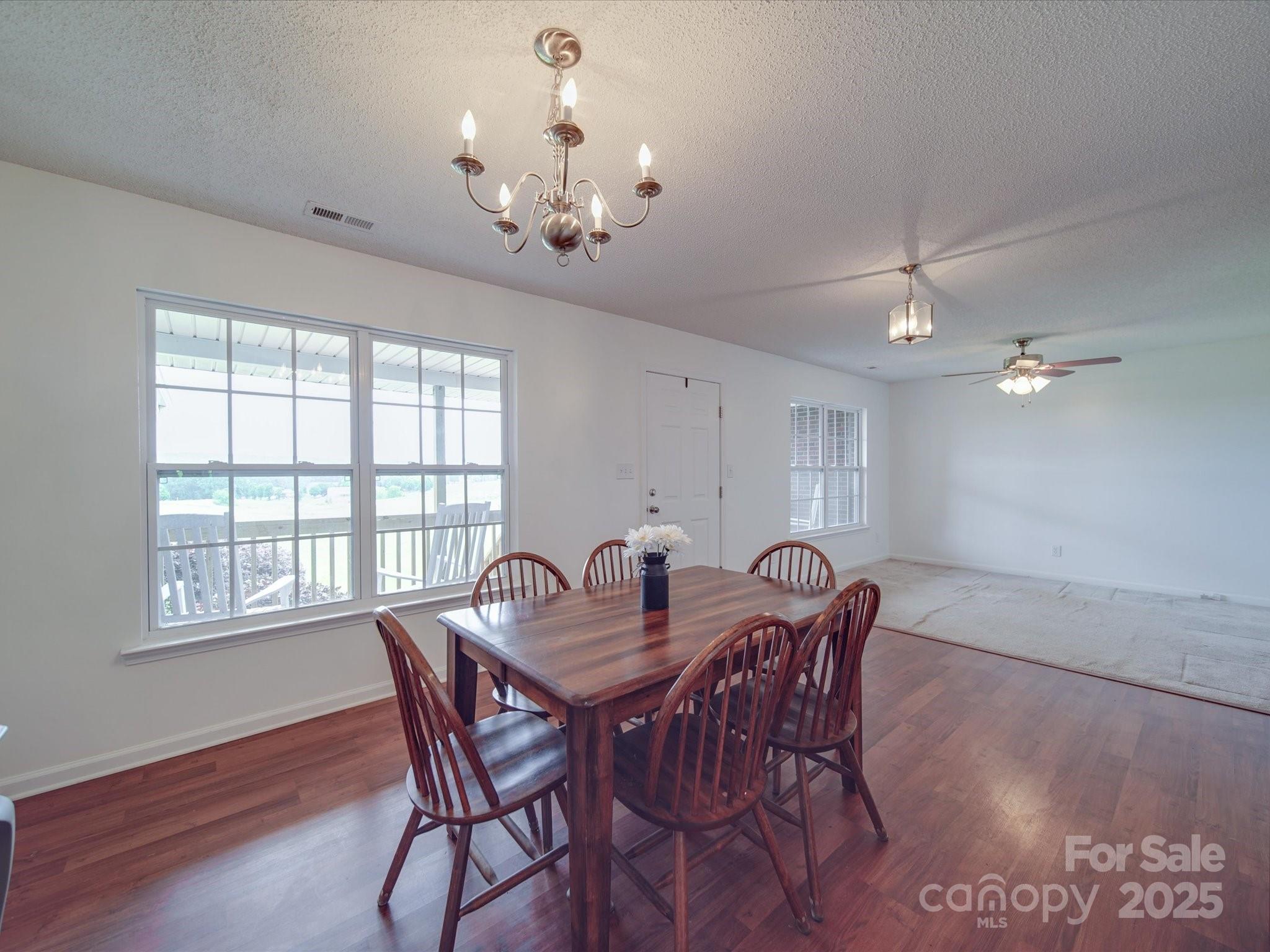 1060 South Lentz Harness Shop Road Mount Pleasant, NC 28124 - Photo 20 of 48 a view of a dining room with furniture window and wooden floor