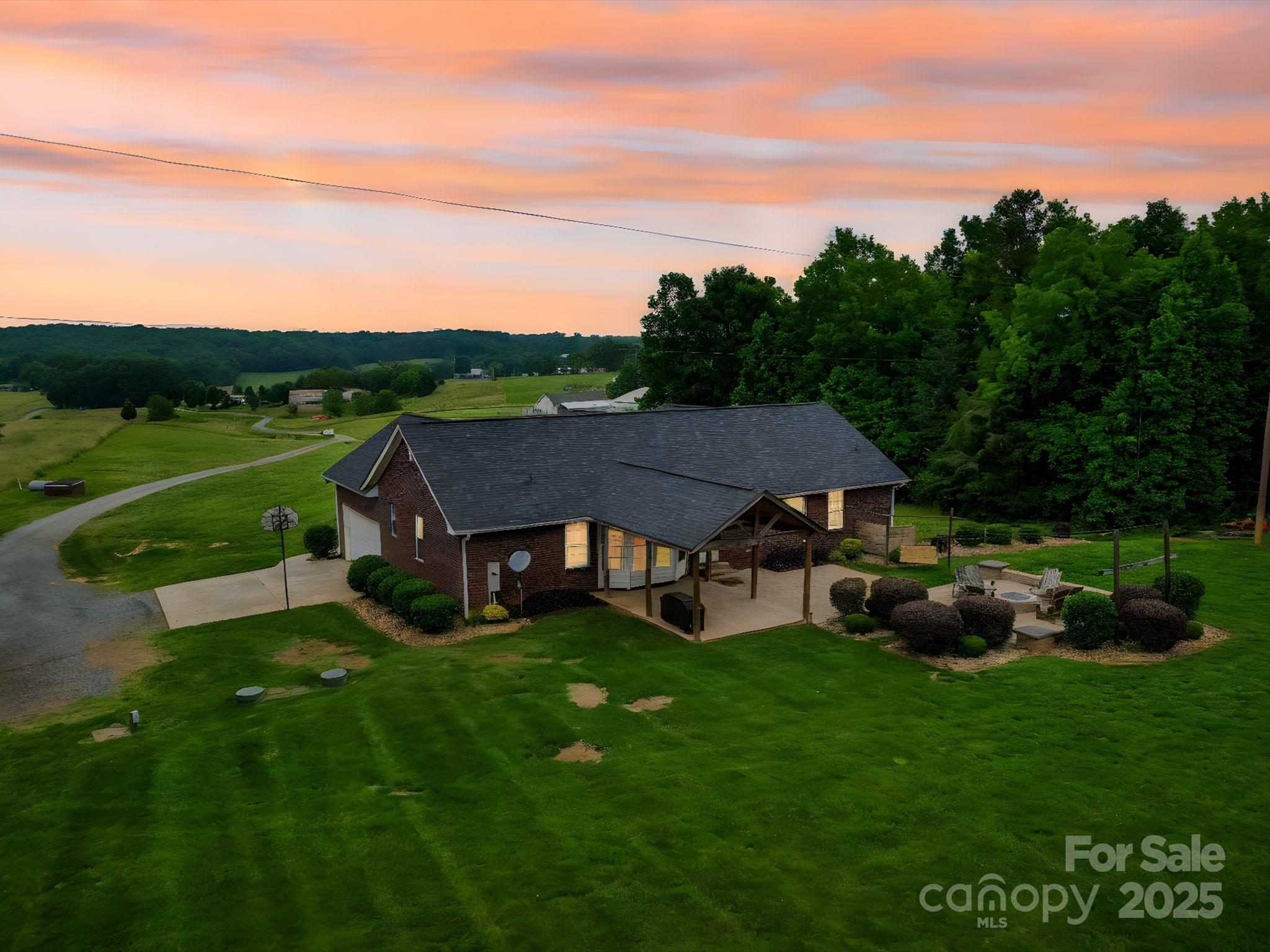 1060 South Lentz Harness Shop Road Mount Pleasant, NC 28124 - Photo 2 of 48 a aerial view of a house with table and chairs