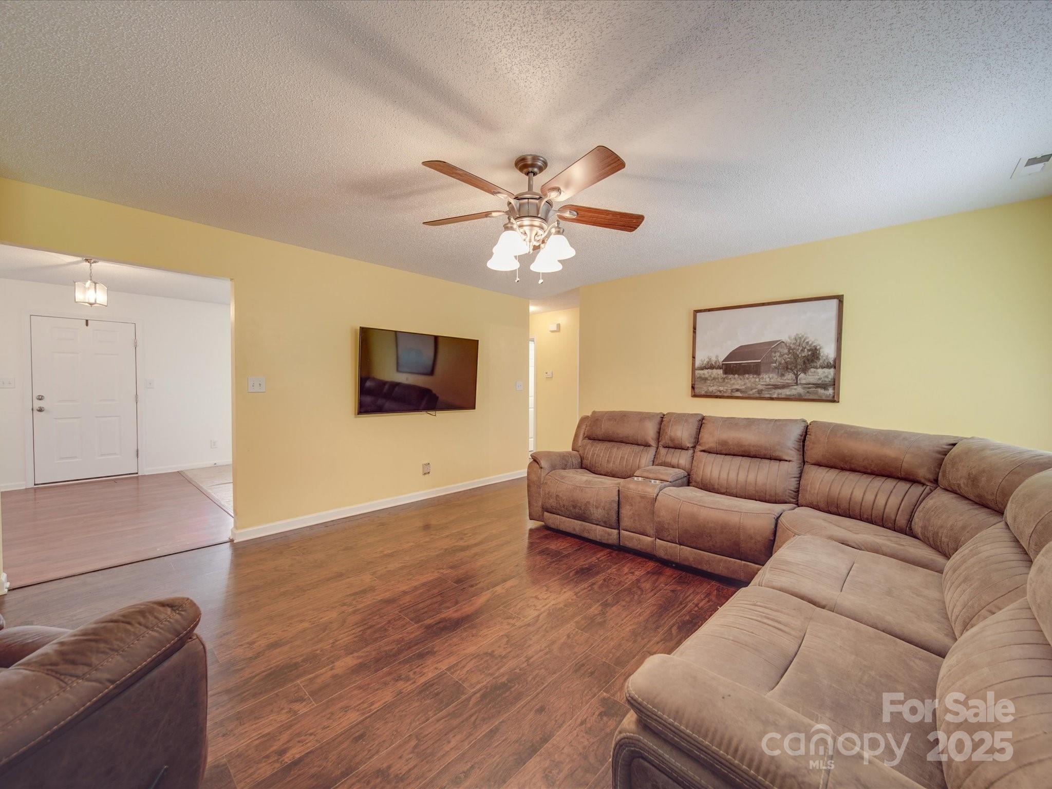 1060 South Lentz Harness Shop Road Mount Pleasant, NC 28124 - Photo 23 of 48 a living room with furniture and a flat screen tv