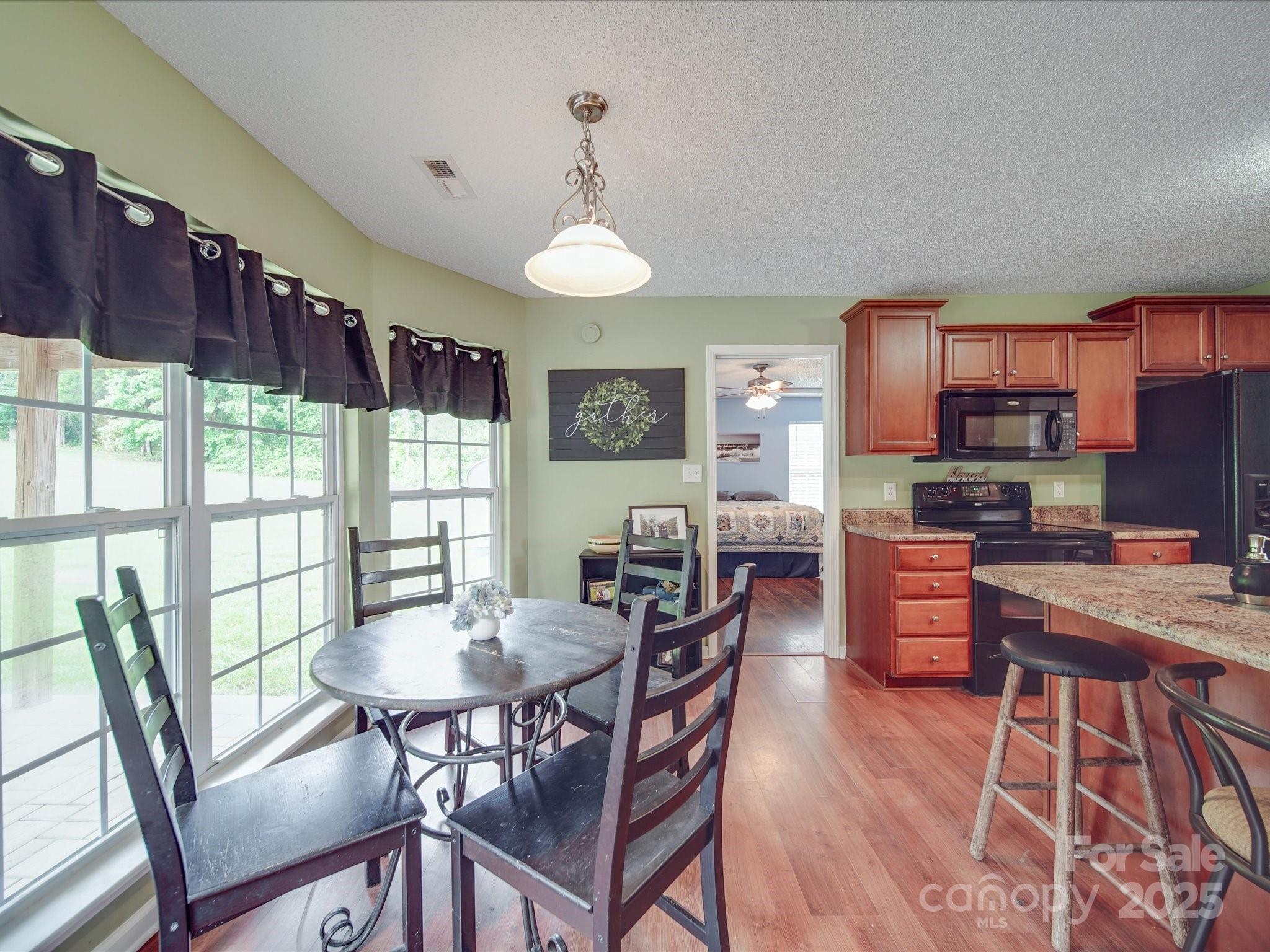 1060 South Lentz Harness Shop Road Mount Pleasant, NC 28124 - Photo 25 of 48 a view of a dining room with furniture window and outside view