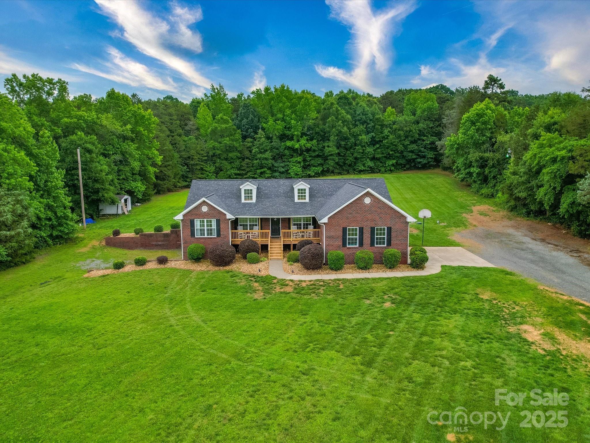 1060 South Lentz Harness Shop Road Mount Pleasant, NC 28124 - Photo 3 of 48 a front view of a house with yard and green space