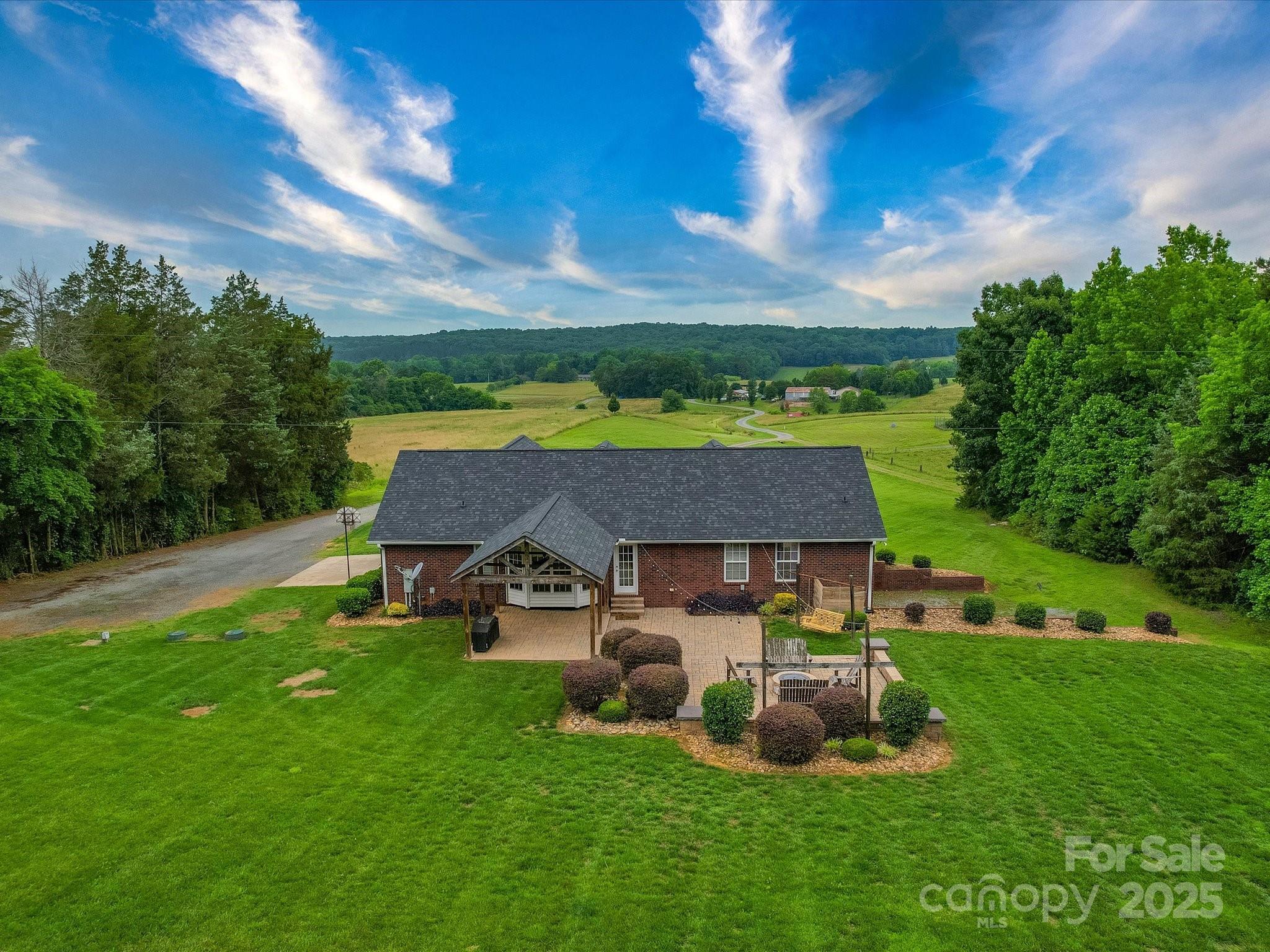 1060 South Lentz Harness Shop Road Mount Pleasant, NC 28124 - Photo 4 of 48 a aerial view of a house with backyard garden and outdoor seating