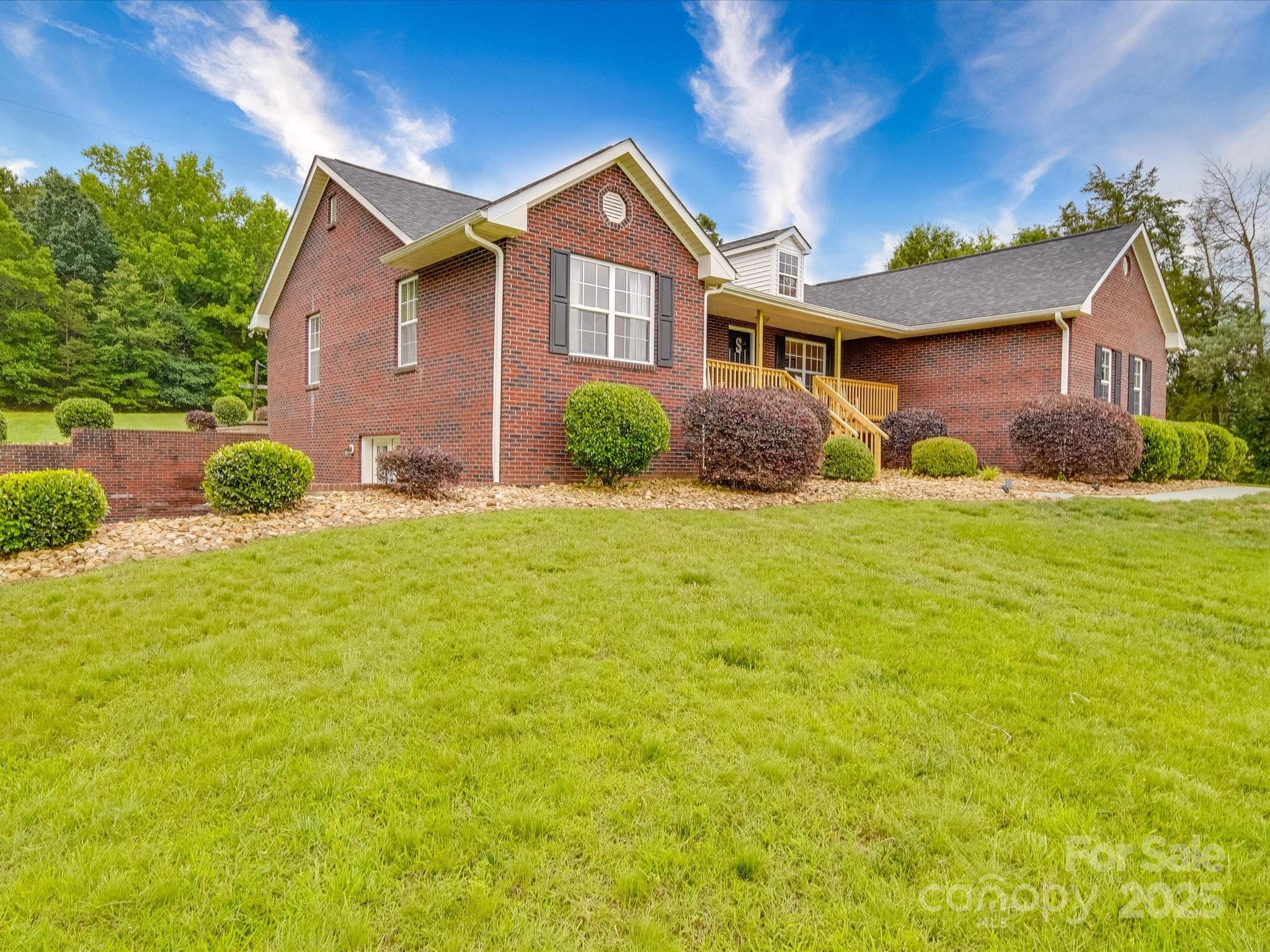 1060 South Lentz Harness Shop Road Mount Pleasant, NC 28124 - Photo 6 of 48 a view of a yard in front of a house with plants