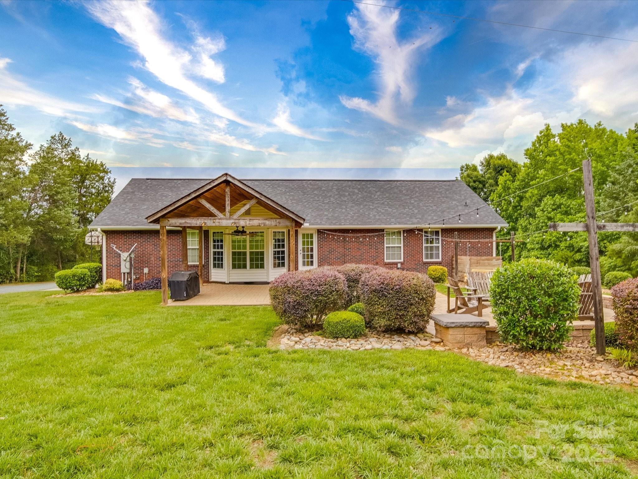 1060 South Lentz Harness Shop Road Mount Pleasant, NC 28124 - Photo 9 of 48 a front view of a house with garden