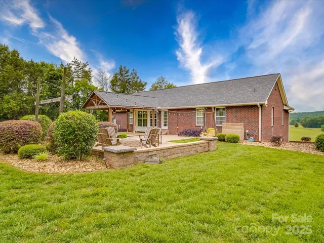 a front view of a house with swimming pool having outdoor seating