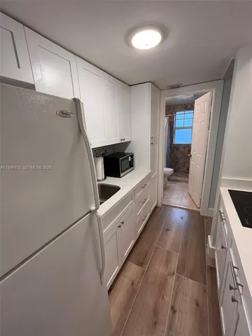 a kitchen with stainless steel appliances a refrigerator and a stove