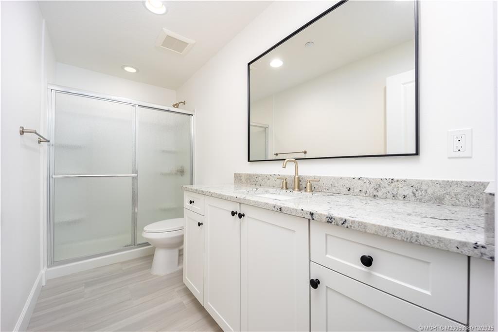 3375 Southwest Mapp Road, Unit 206 Palm City, FL 34990 - Photo 8 of 34 a bathroom with a sink toilet and shower