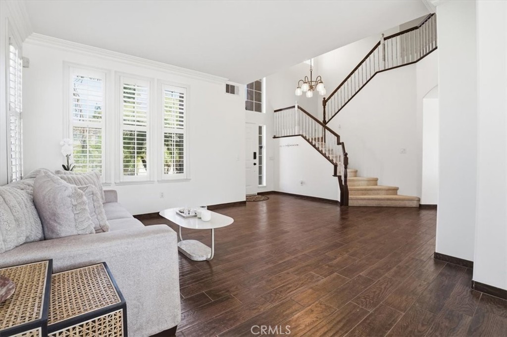 768 Ochee Circle Corona, CA 92879 - Photo 32 of 75 a living room with furniture and a wooden floor
