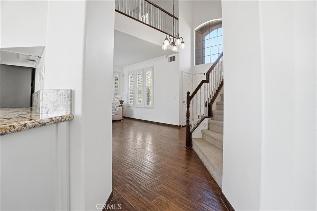 768 Ochee Circle Corona, CA 92879 - Photo 34 of 75 a view of a livingroom with wooden floor and stairs
