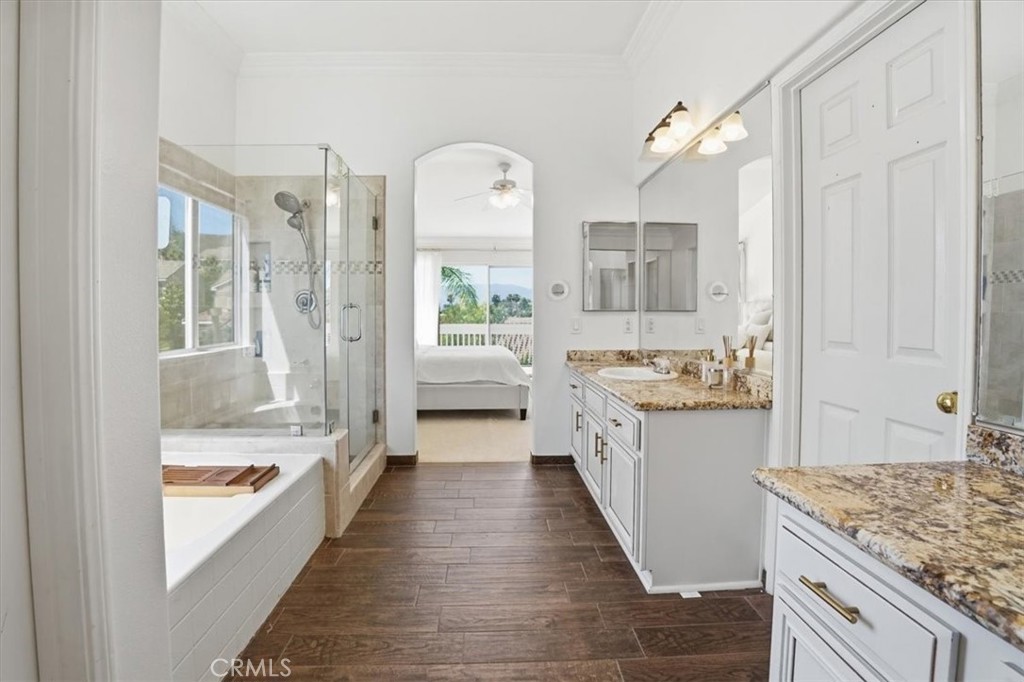 768 Ochee Circle Corona, CA 92879 - Photo 44 of 75 a large white kitchen with granite countertop a sink and cabinets