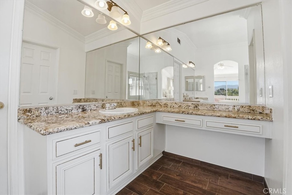 768 Ochee Circle Corona, CA 92879 - Photo 46 of 75 a bathroom with a sink vanity and a mirror