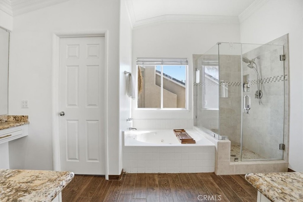 768 Ochee Circle Corona, CA 92879 - Photo 49 of 75 a bathroom with a tub shower and sink