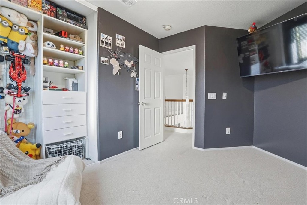 768 Ochee Circle Corona, CA 92879 - Photo 55 of 75 a bedroom with a bed and cabinets