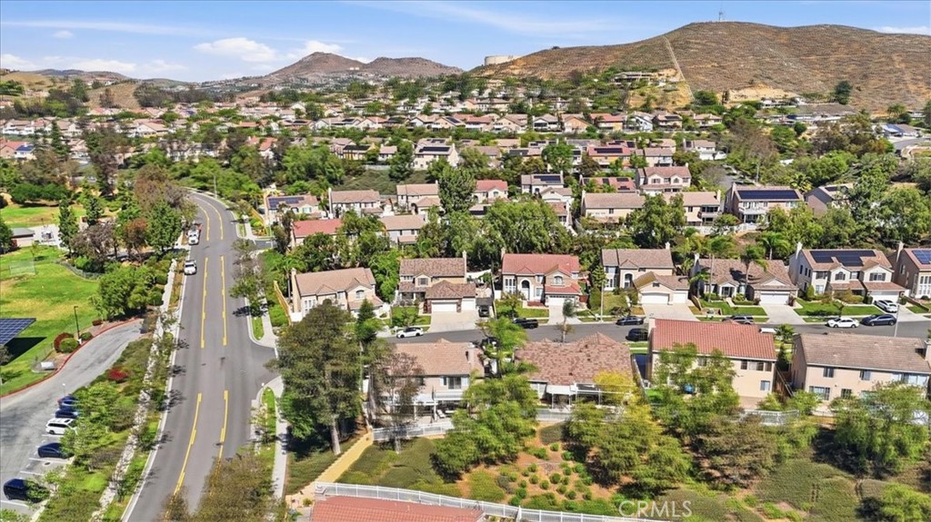 768 Ochee Circle Corona, CA 92879 - Photo 58 of 75 an aerial view of residential houses with outdoor space and trees