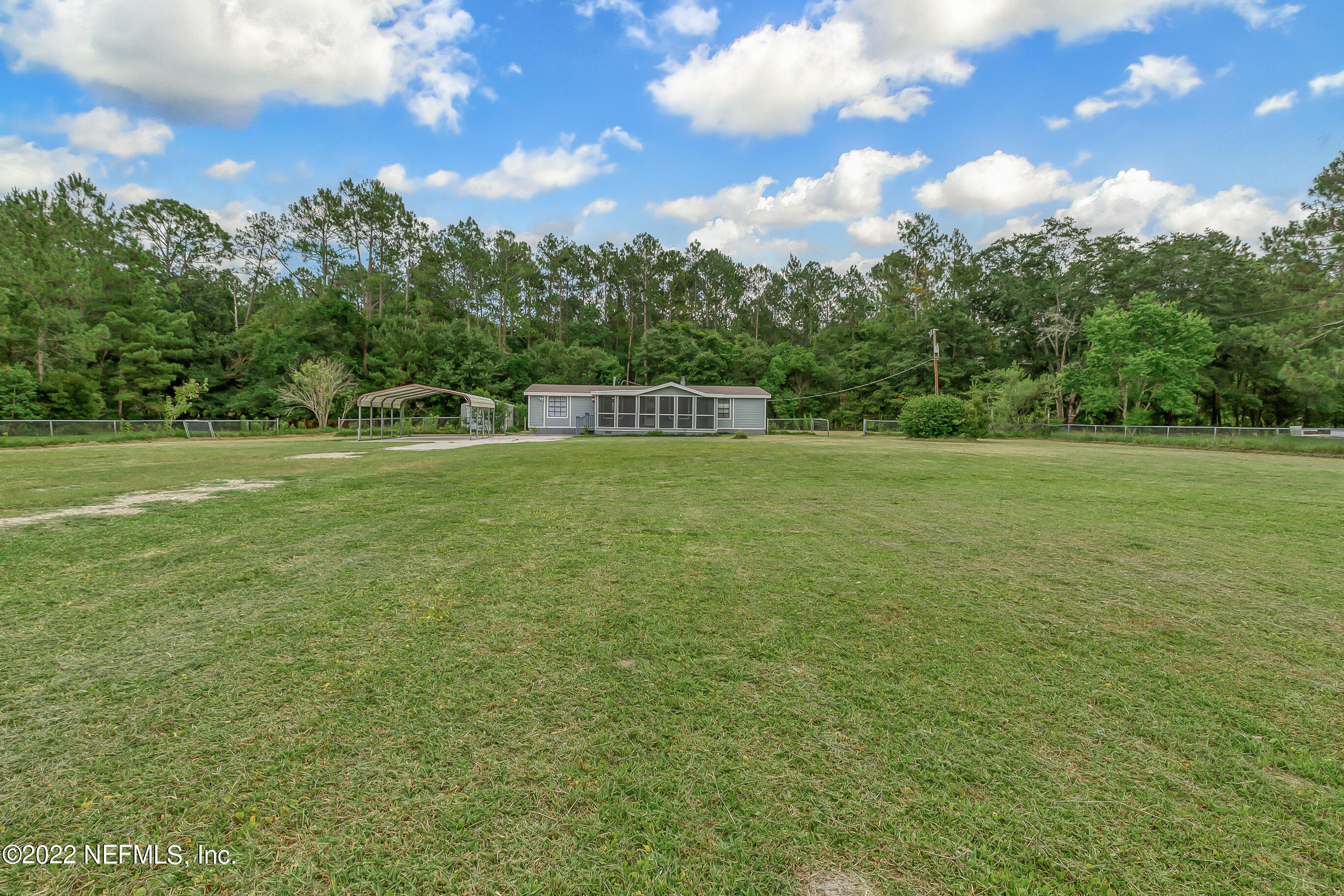 54360 Church Road Callahan, FL 32011 - Photo 14 of 37 a view of a green field with clear sky