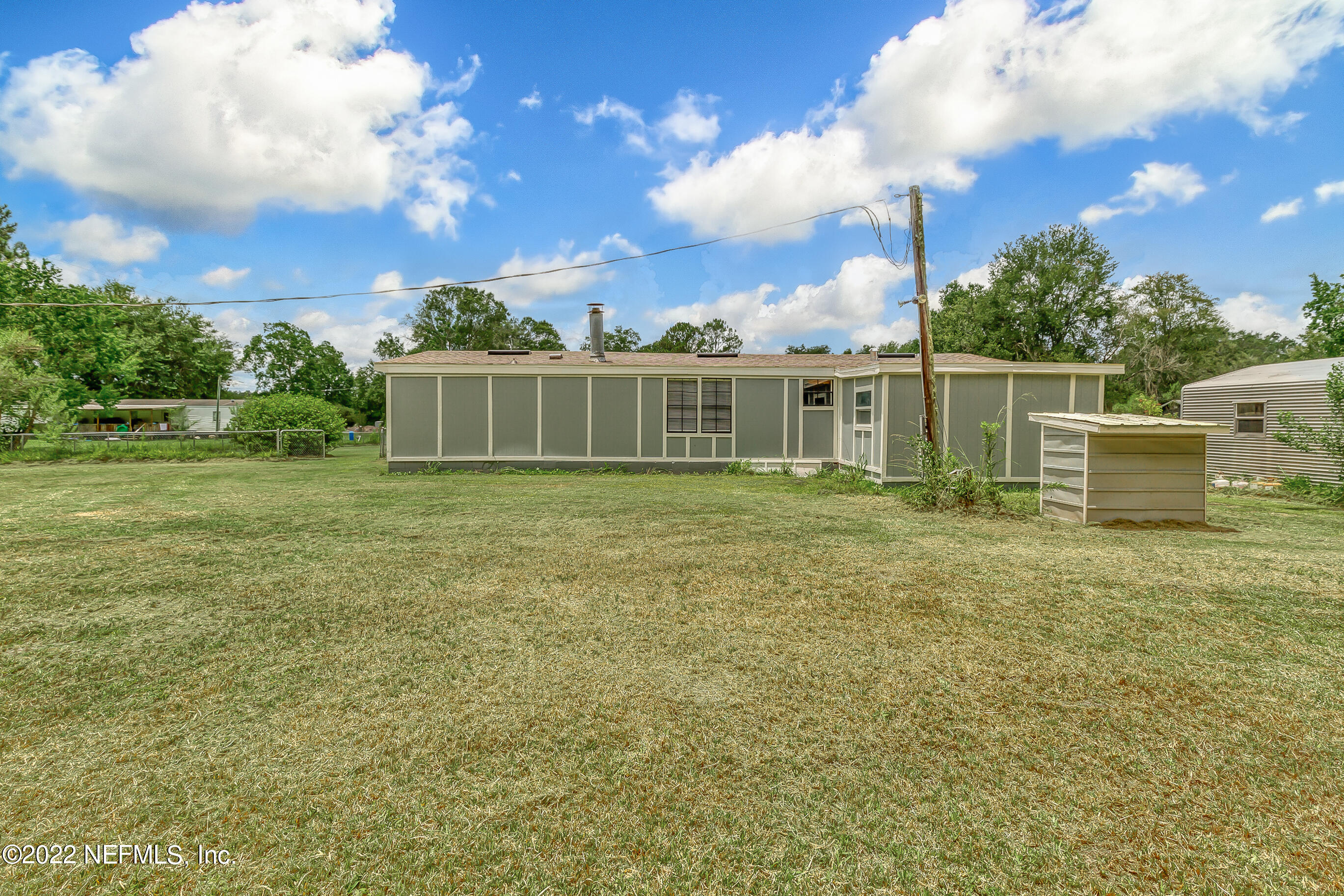 54360 Church Road Callahan, FL 32011 - Photo 16 of 37 a view of a house with a yard