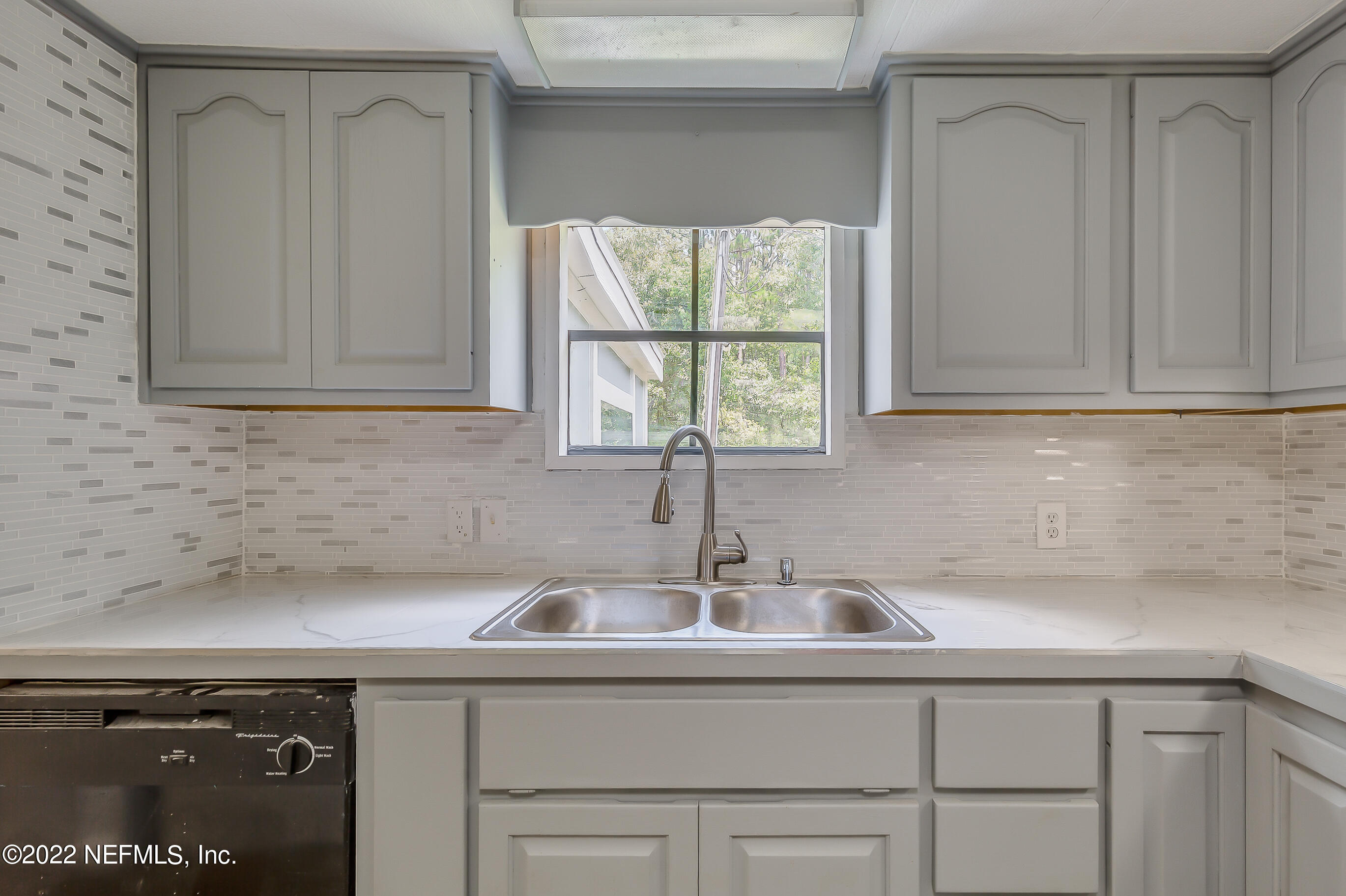 54360 Church Road Callahan, FL 32011 - Photo 21 of 37 a kitchen with a sink and cabinets