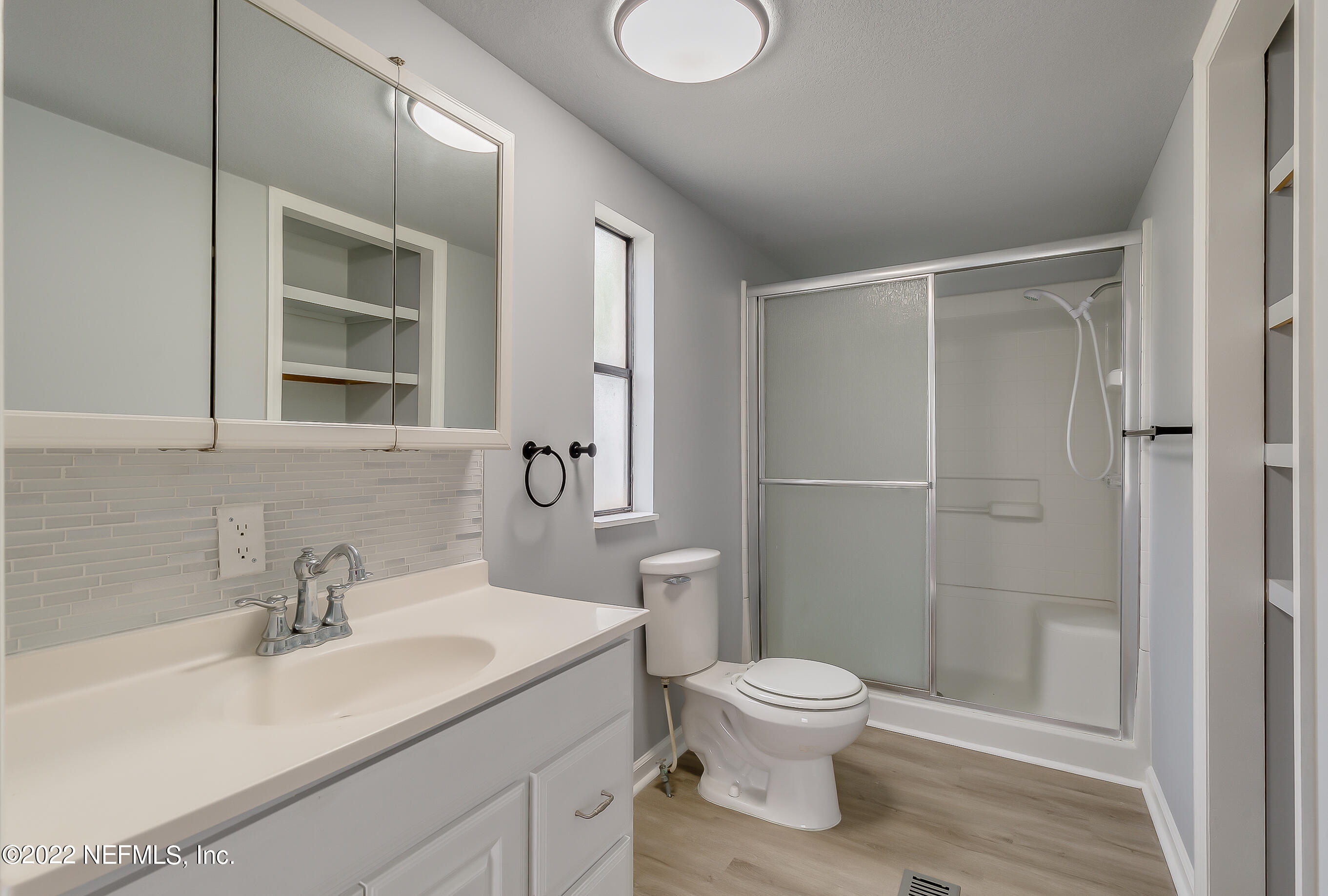 54360 Church Road Callahan, FL 32011 - Photo 6 of 37 a bathroom with a sink toilet and shower