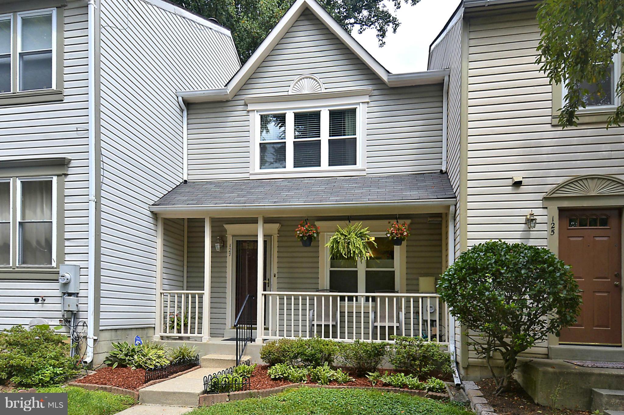 127 Kinsman View Circle Silver Spring, MD 20901 - Photo 1 of 21 a front view of a house with garden