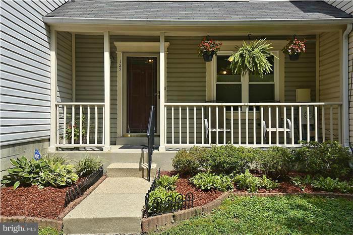 127 Kinsman View Circle Silver Spring, MD 20901 - Photo 3 of 21 a view of a house with a window and flower garden