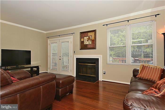 127 Kinsman View Circle Silver Spring, MD 20901 - Photo 7 of 21 a living room with furniture and a flat screen tv