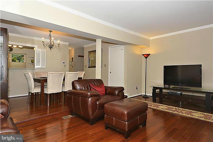 127 Kinsman View Circle Silver Spring, MD 20901 - Photo 9 of 21 a living room with furniture and a flat screen tv