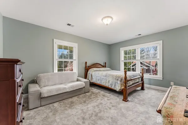 a view of house with a yard