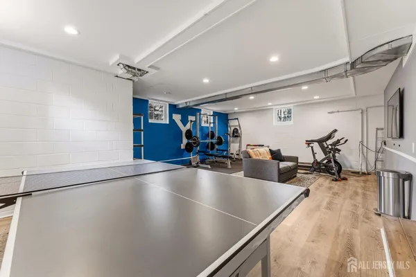 a view of a big house with a big yard and large trees