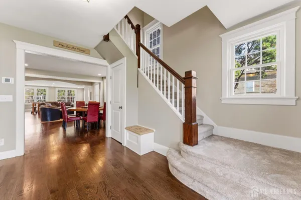 a view of a livingroom with furniture and hardwood floor