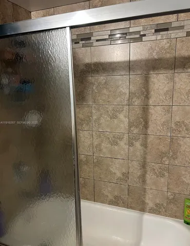 a kitchen with sink a faucet and couch