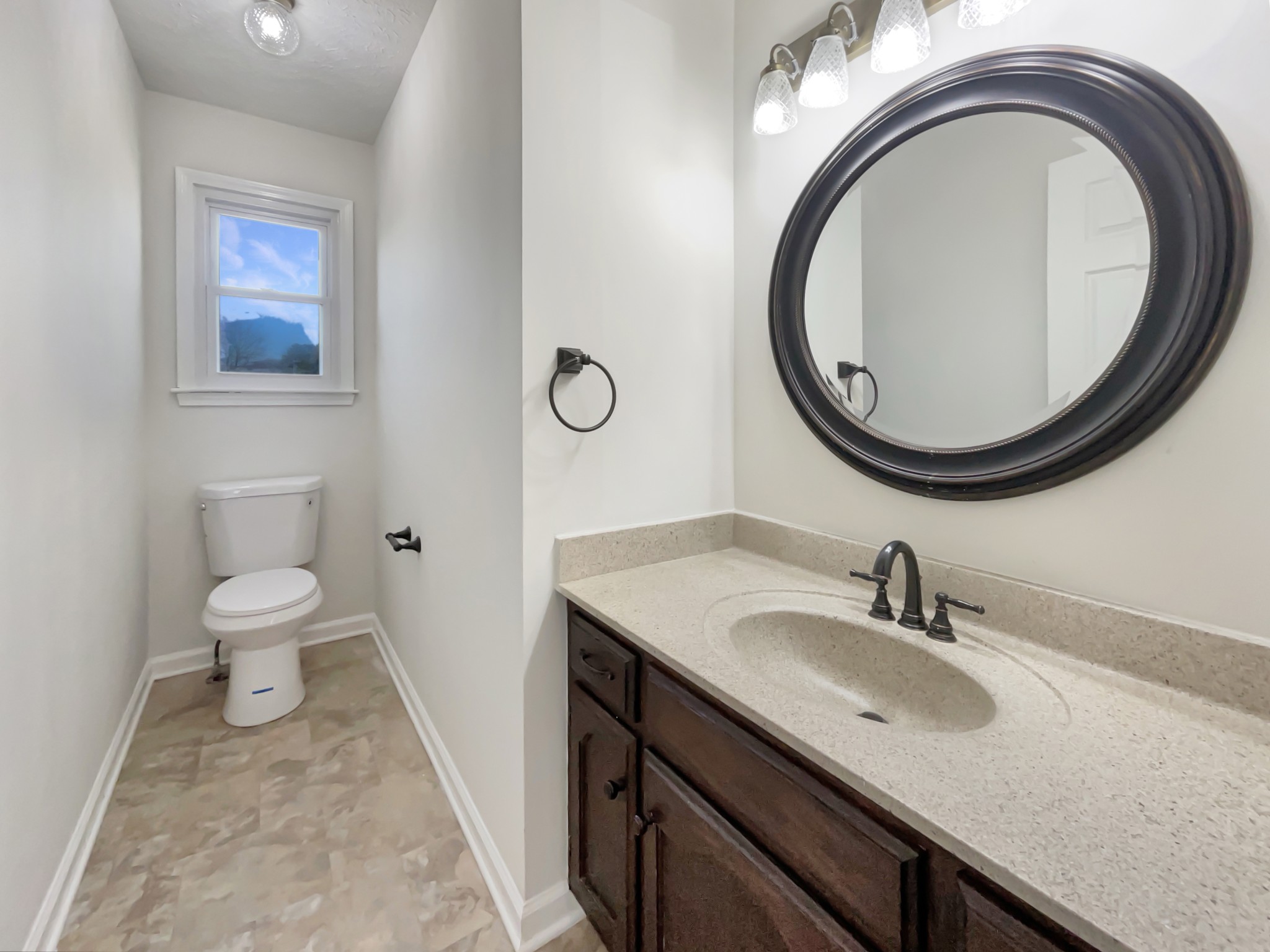 403 Canaan Road Columbia, TN 38401 - Photo 13 of 23 a bathroom with a toilet a sink and a mirror