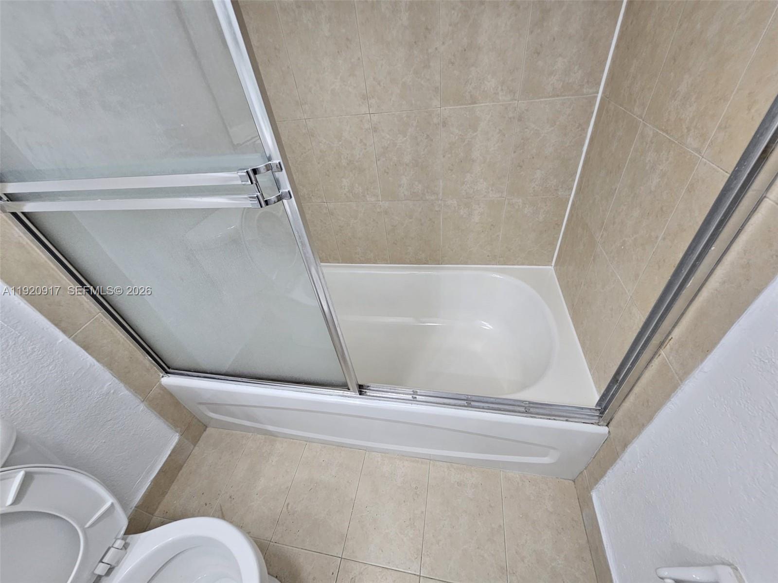 4550 Northwest 9th Street, Unit 217E Miami, FL 33126 - Photo 14 of 14 a view of walk in closet with clothes