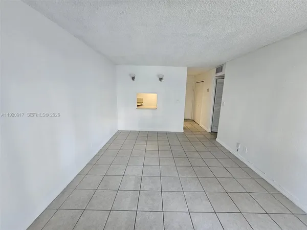a view of an empty room and window