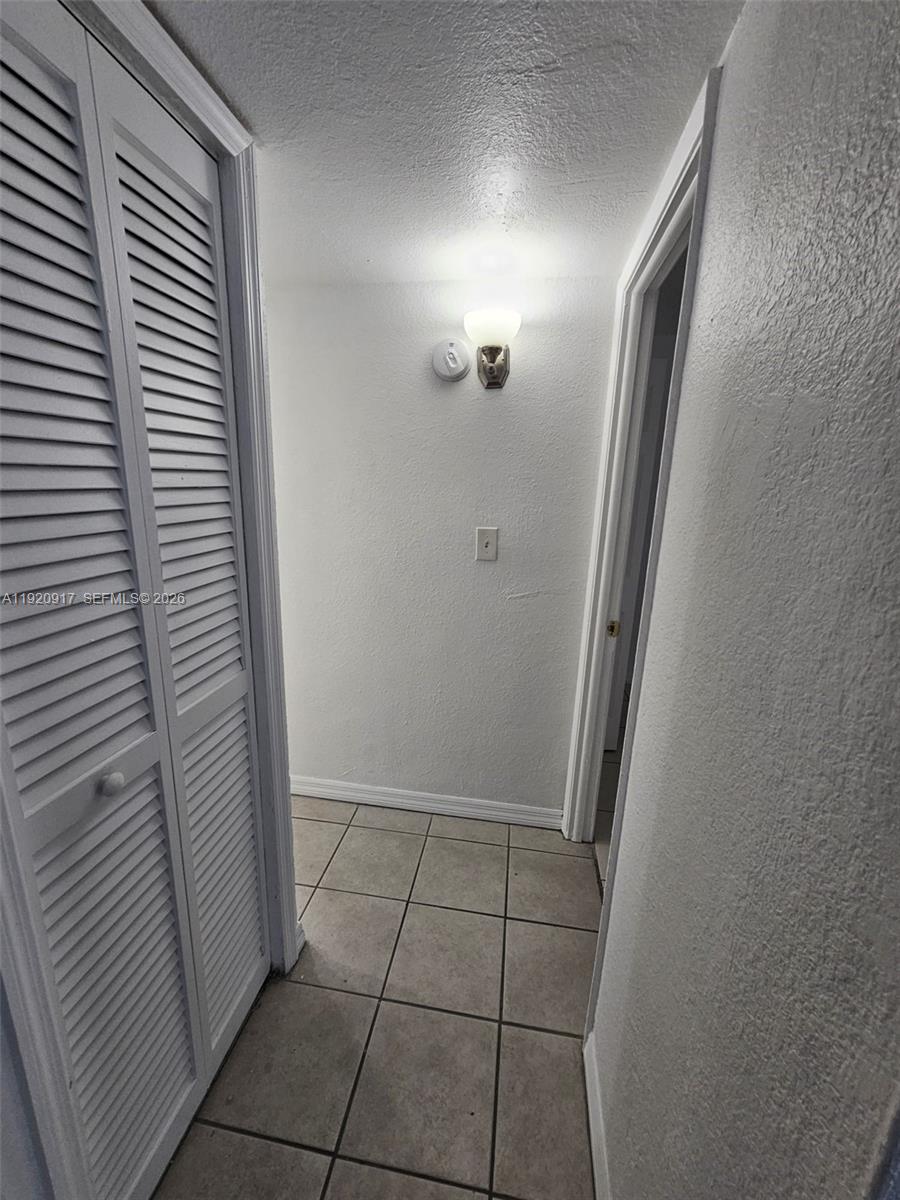 4550 Northwest 9th Street, Unit 217E Miami, FL 33126 - Photo 9 of 14 a view of an empty room