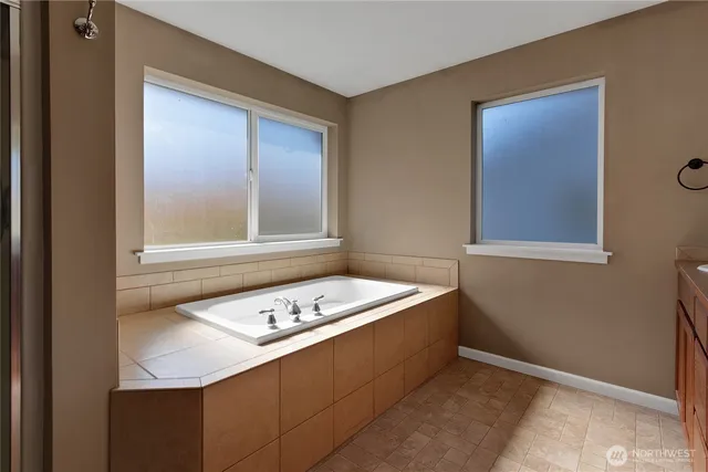 a bathroom with a sink and a window