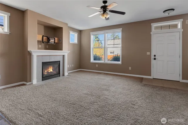 a view of empty room with a fireplace