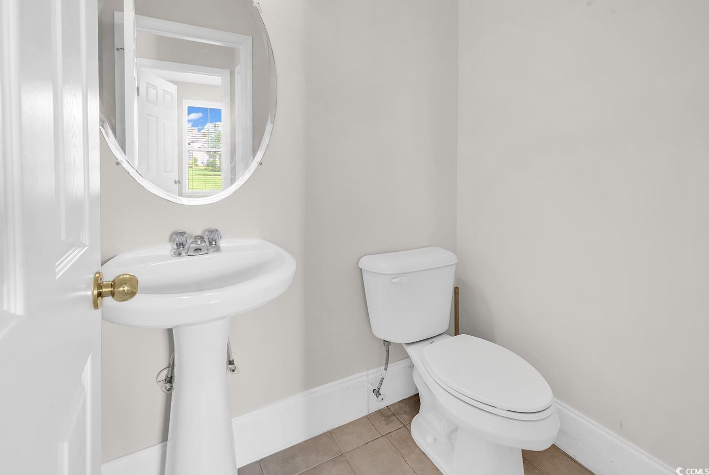 101 Culpepper Way, Unit 1006 Myrtle Beach, SC 29579 - Photo 11 of 40 Bathroom with toilet, tile patterned floors, baseboards, and a sink