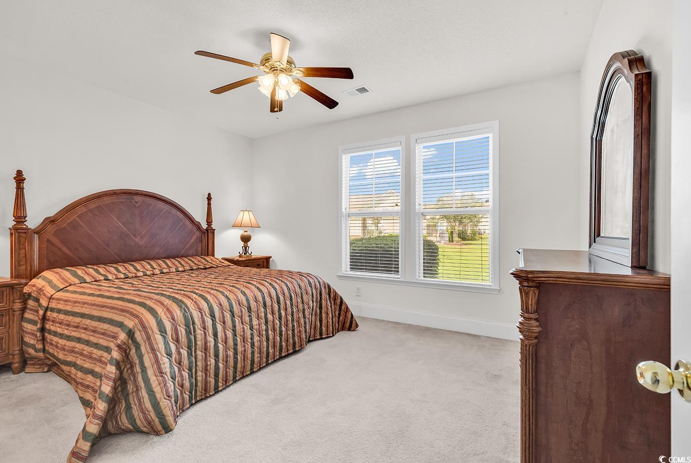 101 Culpepper Way, Unit 1006 Myrtle Beach, SC 29579 - Photo 12 of 40 Bedroom with carpet, ceiling fan, and baseboards