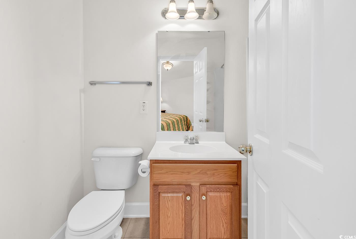 101 Culpepper Way, Unit 1006 Myrtle Beach, SC 29579 - Photo 22 of 40 Bathroom with ensuite bathroom, vanity, toilet, and baseboards