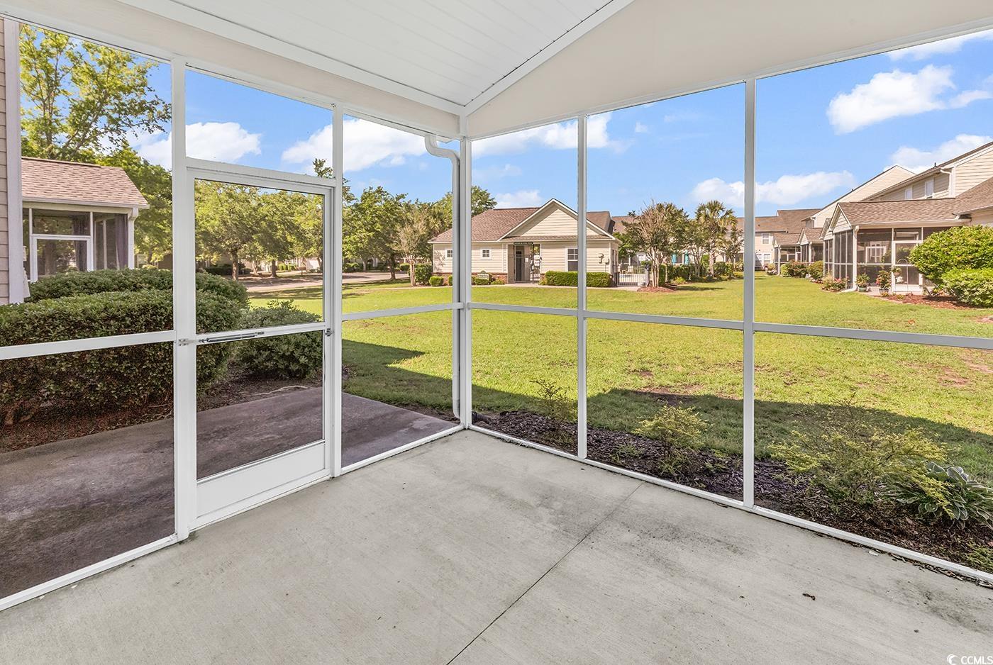 101 Culpepper Way, Unit 1006 Myrtle Beach, SC 29579 - Photo 26 of 40 Unfurnished sunroom with a residential view and vaulted ceiling