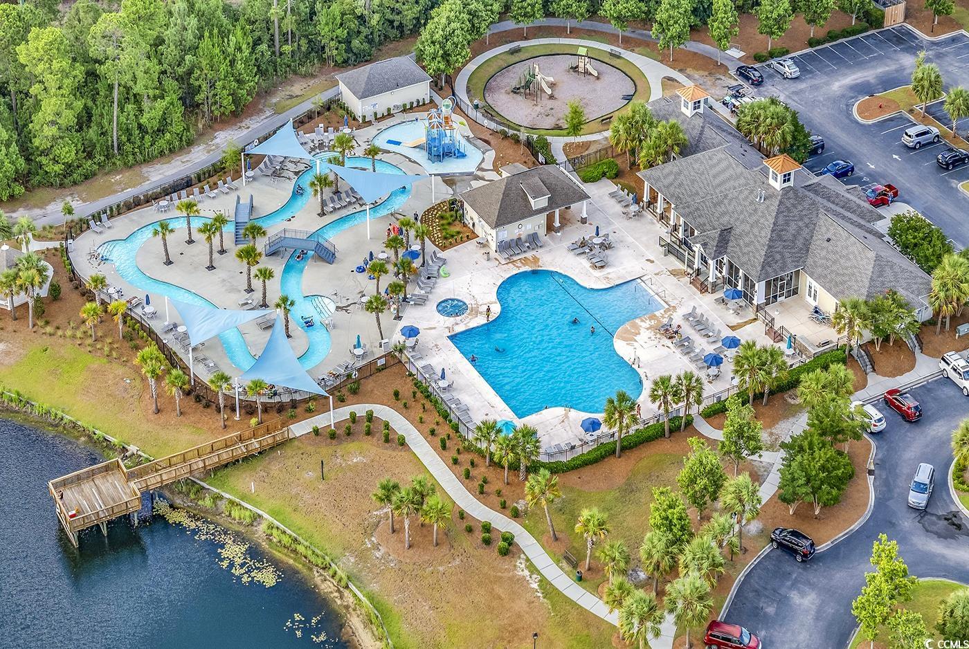 101 Culpepper Way, Unit 1006 Myrtle Beach, SC 29579 - Photo 39 of 40 Aerial view of a pool area and a large body of water